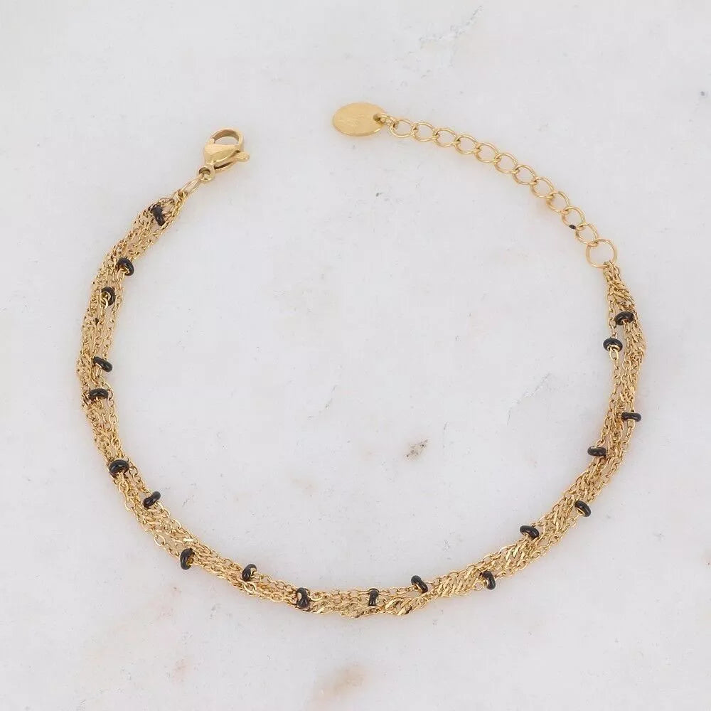 Bracelet Frédérique – chaîne tressée dorée et perles noires